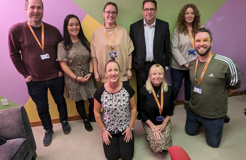 •	[Left-to-right; from back row]: Stevie Baxter (Independent Living Support Worker); Nicola Melvin (Groups Support Worker); Mhairi Kiernan (Employability Support Worker); Craig Hoy MSP; Lynne Anderson (Education and Employability Coordinator); Emma Scarcliffe (CEO); Natasha McInninie (Practice Manager); and Grant Hamilton (Personal Development Worker)