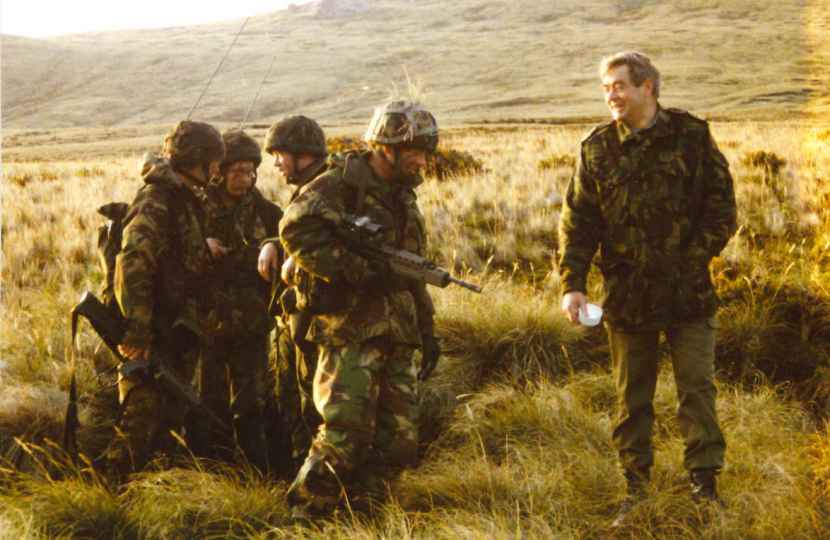 Neil Rankin (far right) with soldiers at Second Creek Range in the Falklands