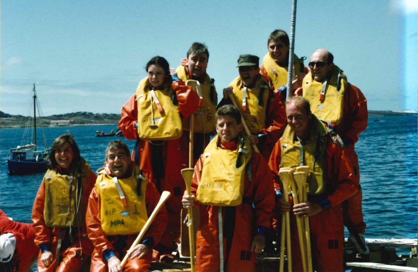 Neil Rankin (front row, second from the left) with wife Jill (front row, far left) taking part in a raft race in the Falklands