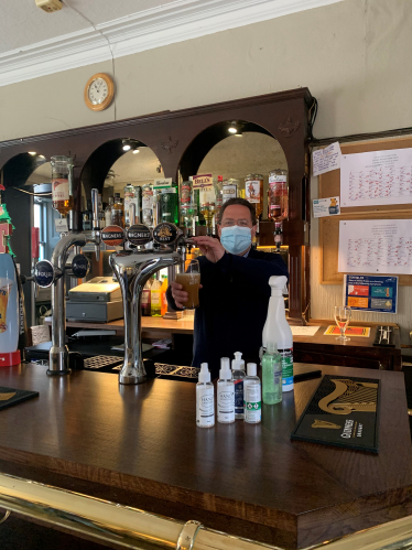 Craig Hoy MSP pulling a pint at Plough Tavern